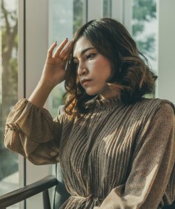 depressed young woman having headache, feeling sad, worry about problem